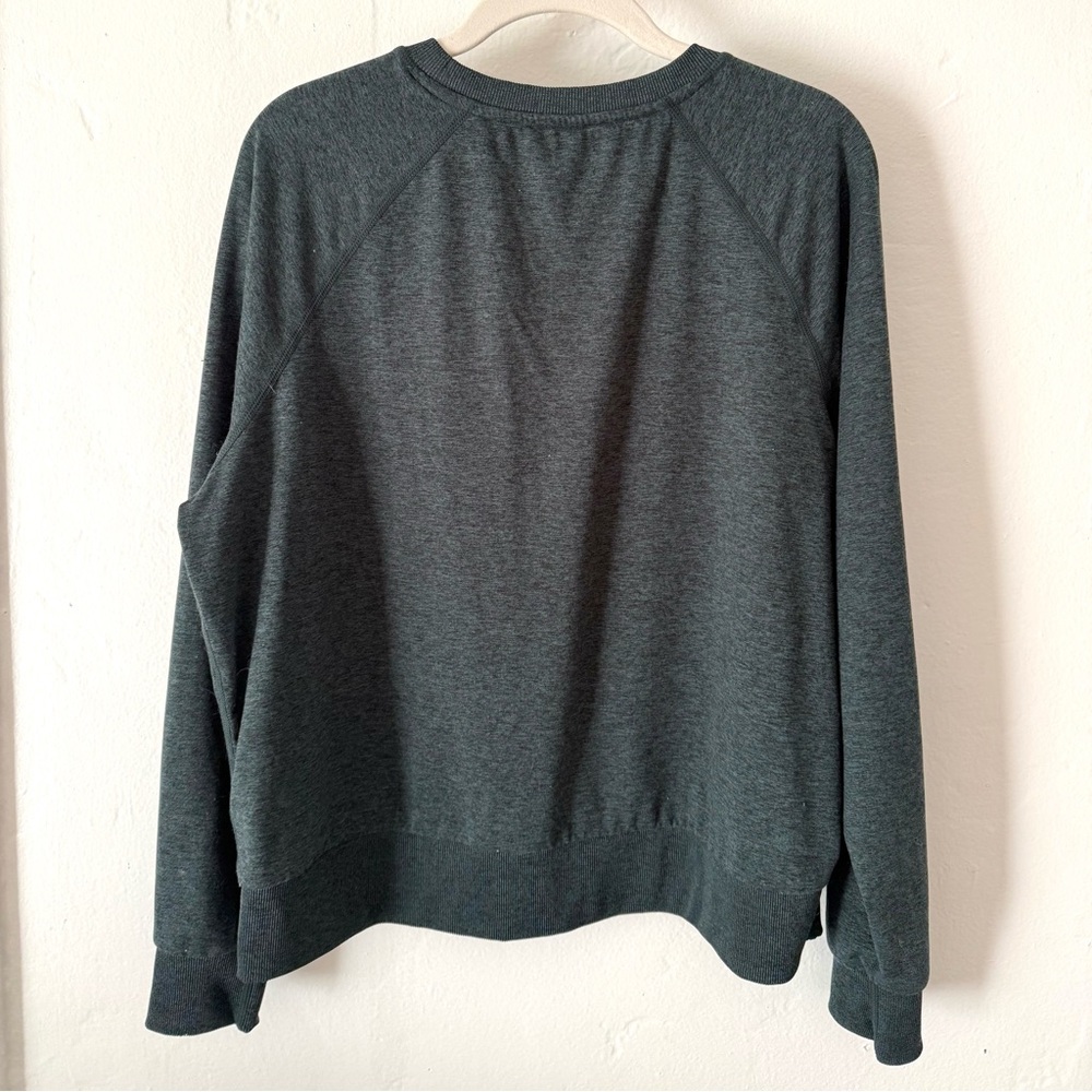 Quince Pullover Crew. Color: Heather Green.